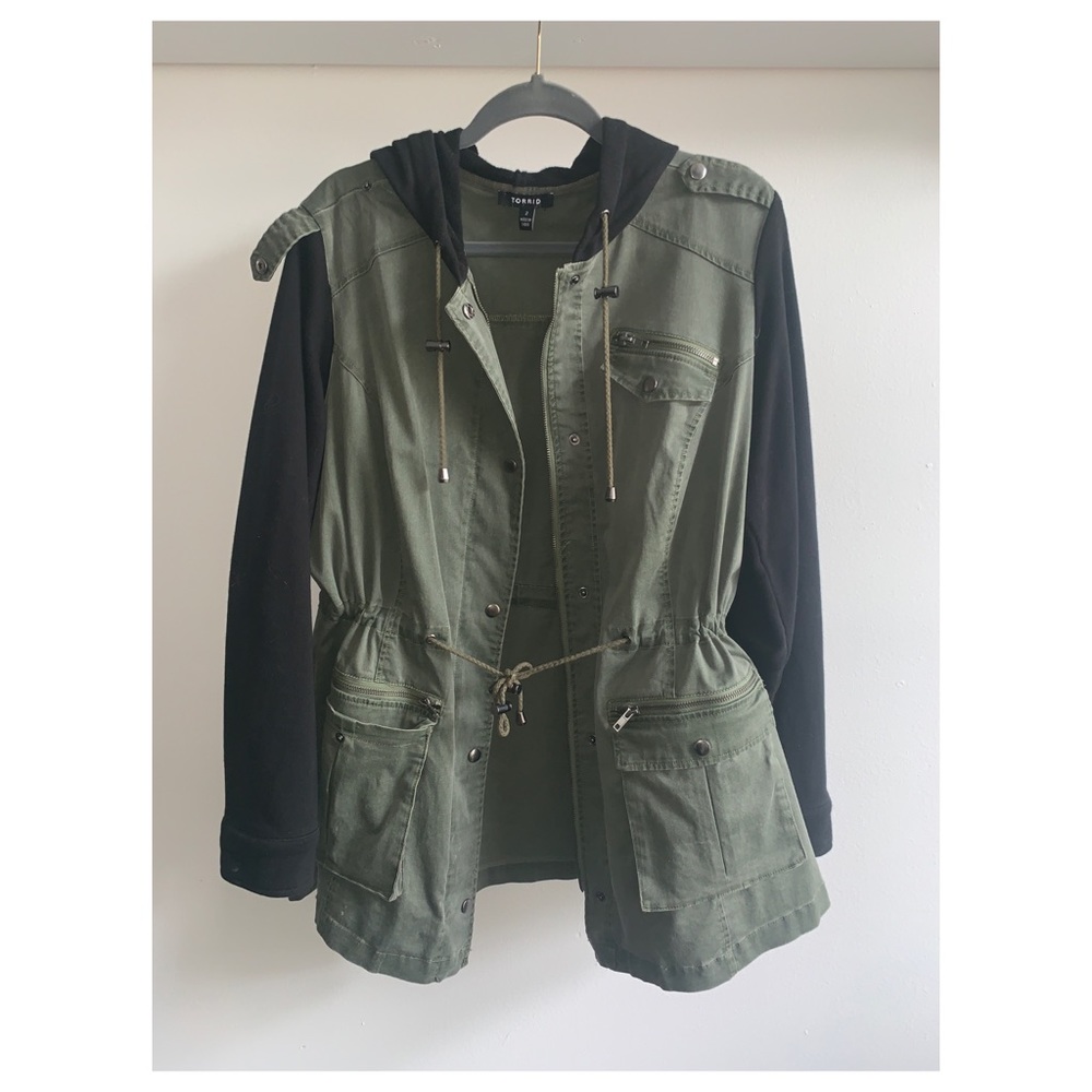 Green utility jacket with black hoodie